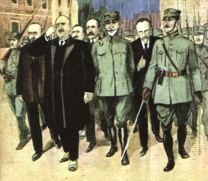Οι Έξι, Πρωτοπαπαδάκης, Μπαλτατζής, Στράτος, Θεοτόκης, Χατζ(η)ανέστης και Γούναρης, κριθέντες ένοχοι για την Μικρασιατική Καταστροφή μετά το στρατιωτικό κίνημα των «φυγάδων του μετώπου», οδηγούνται στο εκτελεστικό απόσπασμα το πρωί της 15ης Νοεμβρίου 1922. Αναπαράσταση από το γαλλικό περιοδικό Le Petit Journal, τχ. 1668, 10/12/1922. Η εικονογράφηση αυτή συνόδευε το ρεπορτάζ του περιοδικού από τη δίκη και χρησιμοποιήθηκε στο εξώφυλλο του βιβλίου του Θανάση Διαμαντόπουλου, Η κορύφωση του Εθνικού Διχασμού. Η Δίκη των Έξι: «Αναγκαίο λάθος» ή «δικαστικός φόνος»; (Πατάκη, 2022).       