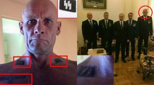 2016. Ο Ντμίτρι Ούτκιν (σε κύκλο) με αντρική συντροφιά στην οποία προέχει ο ρώρος πρόεδρος Πούτιν. Κατά τους βρετανικούς Time, ο Ούτκιν (το κορμί του οποίου «κοσμούν» ναζιστικά σύμβολα) έχει σταλεί στην Ουκρανία επικεφαλής παραστρατιωτικής ομάδας με εντολή να δολοφονήσει τον ουκρανό πρόεδρο Ζελένσκι, να κάνει δηλαδή την «αποναζιστικοποίηση» που διακηρύττει η ρωσική προπαγάνδα.